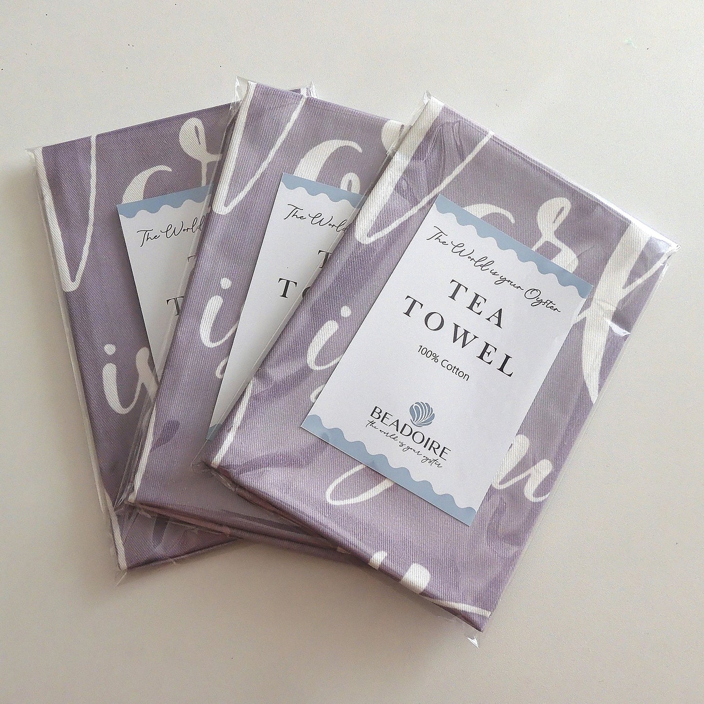 'THE WORLD IS YOUR OYSTER' TEA TOWEL - Grey & White