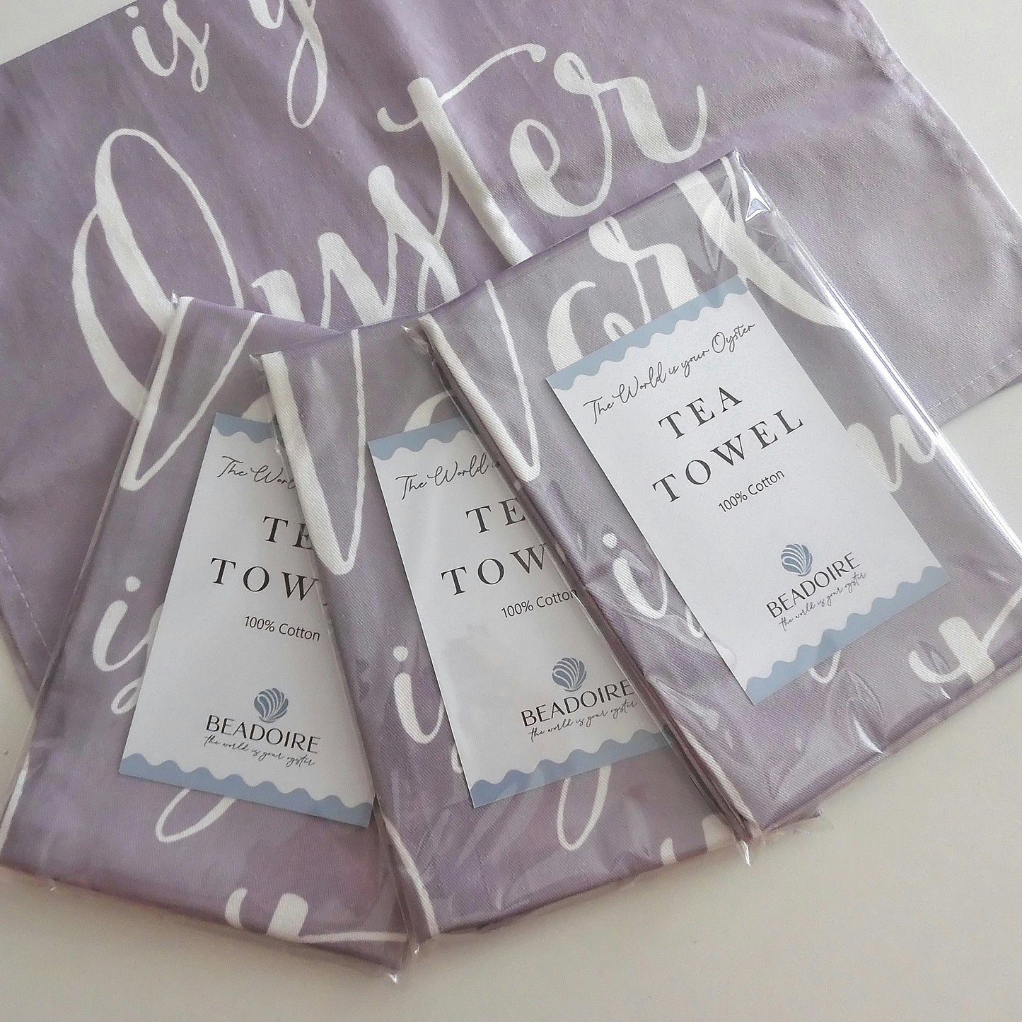 'THE WORLD IS YOUR OYSTER' TEA TOWEL - Grey & White