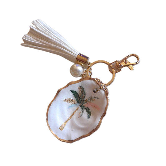 GOLD TASSEL KEYRING WITH OYSTER SHELL CHARM - PALM TREE