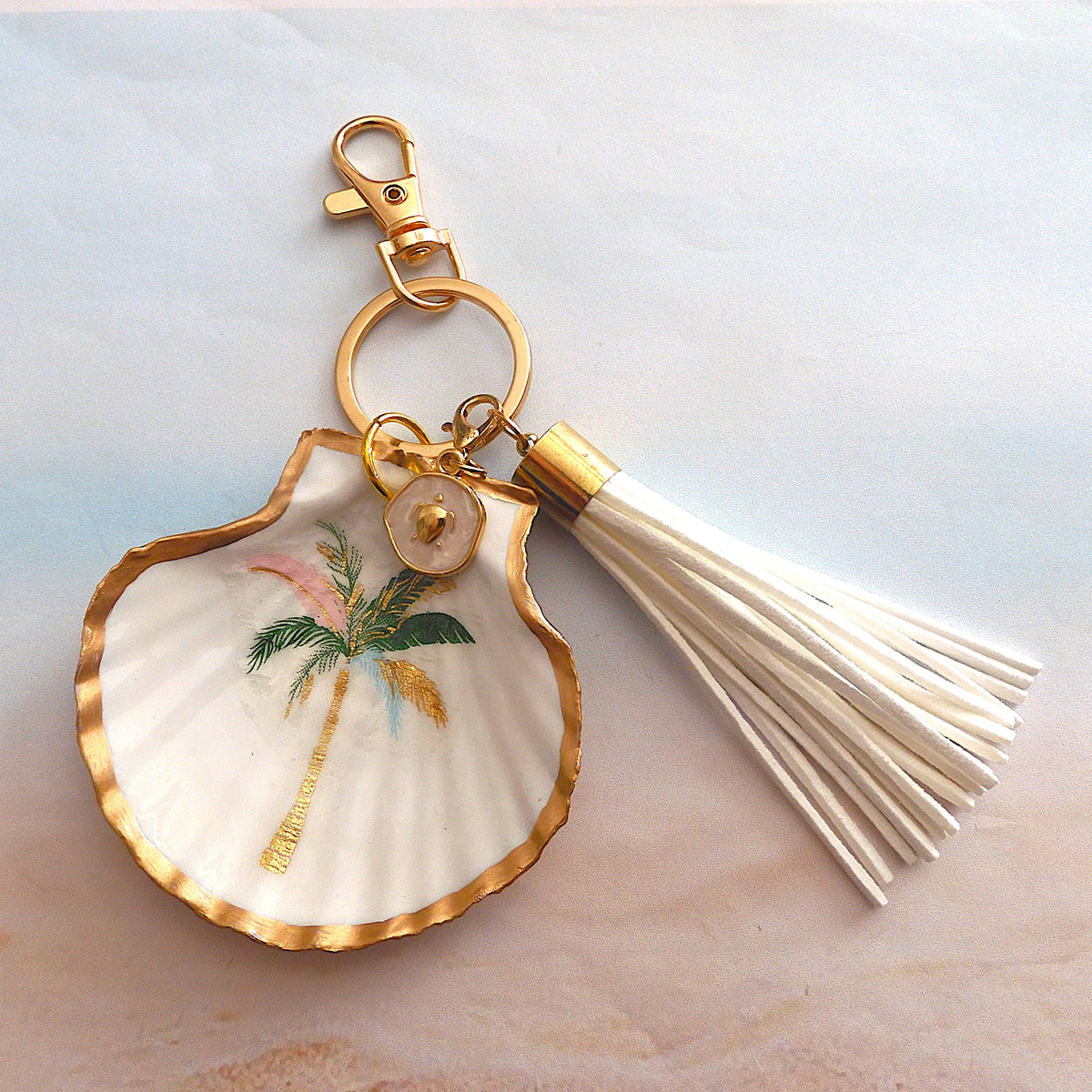 GOLD TASSEL KEYRING WITH SCALLOP SHELL CHARM - 'Palm Tree'