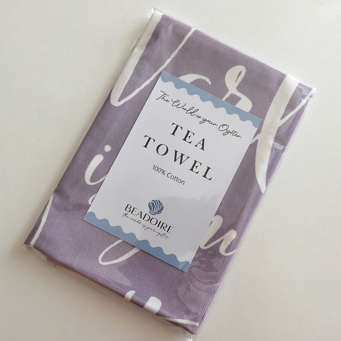 'THE WORLD IS YOUR OYSTER' TEA TOWEL - Grey & White