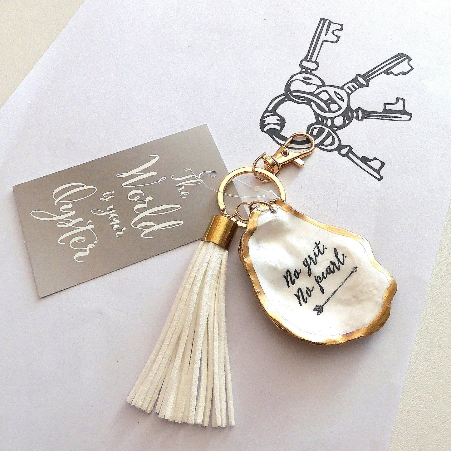 GOLD TASSEL KEYRING 'NO GRIT NO PEARL' OYSTER SHELL