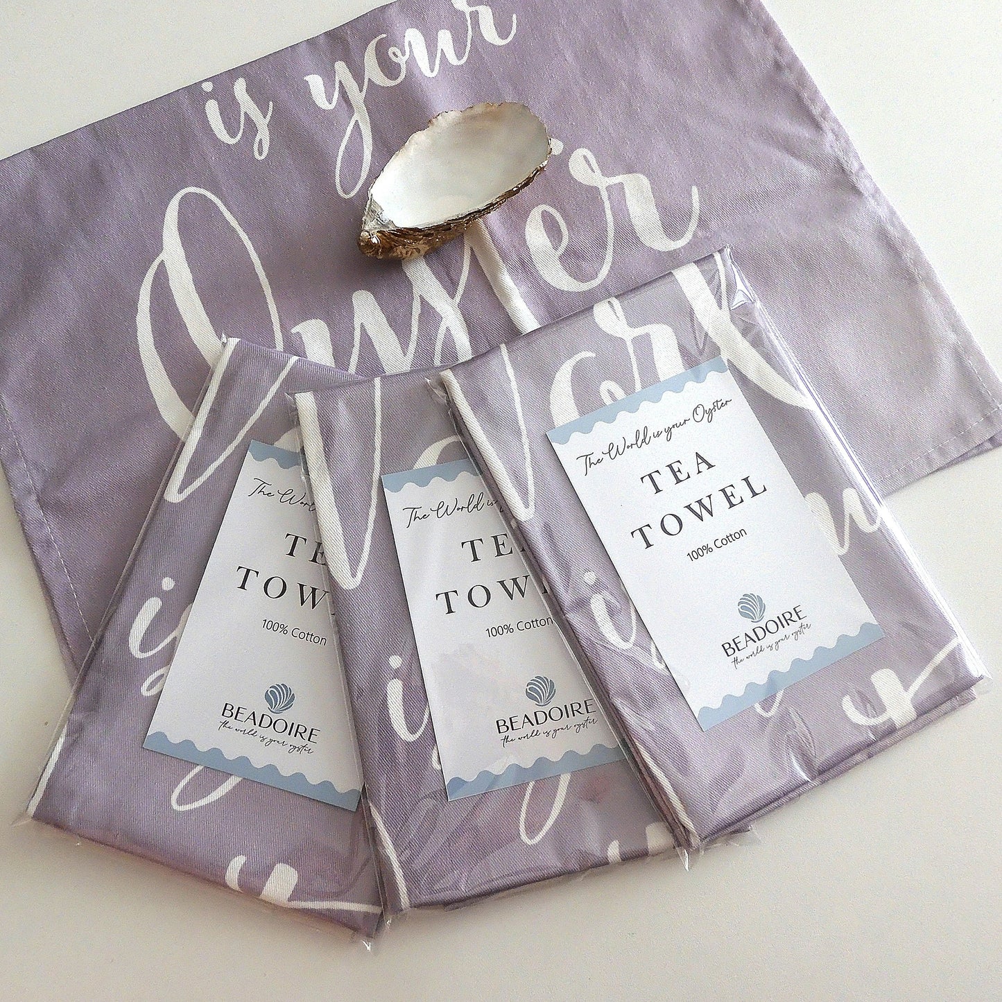 'THE WORLD IS YOUR OYSTER' TEA TOWEL - Grey & White