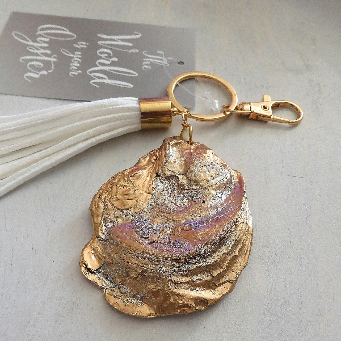 GOLD TASSEL KEYRING 'NO GRIT NO PEARL' OYSTER SHELL