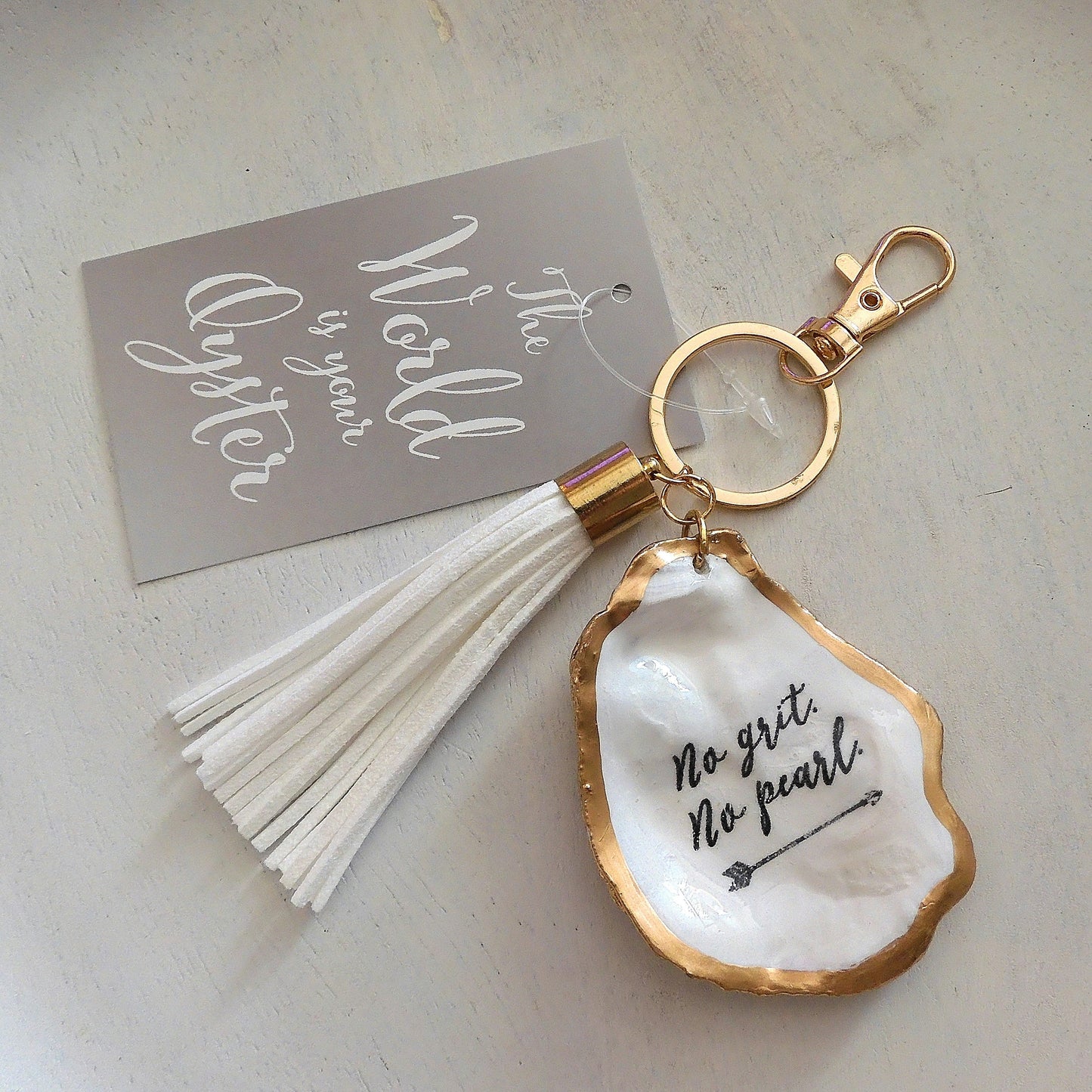 GOLD TASSEL KEYRING 'NO GRIT NO PEARL' OYSTER SHELL