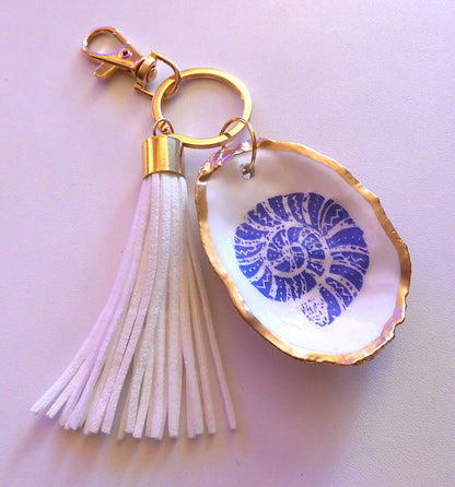 GOLD TASSEL KEYRING WITH OYSTER SHELL CHARM - Blue Nautilus Shell