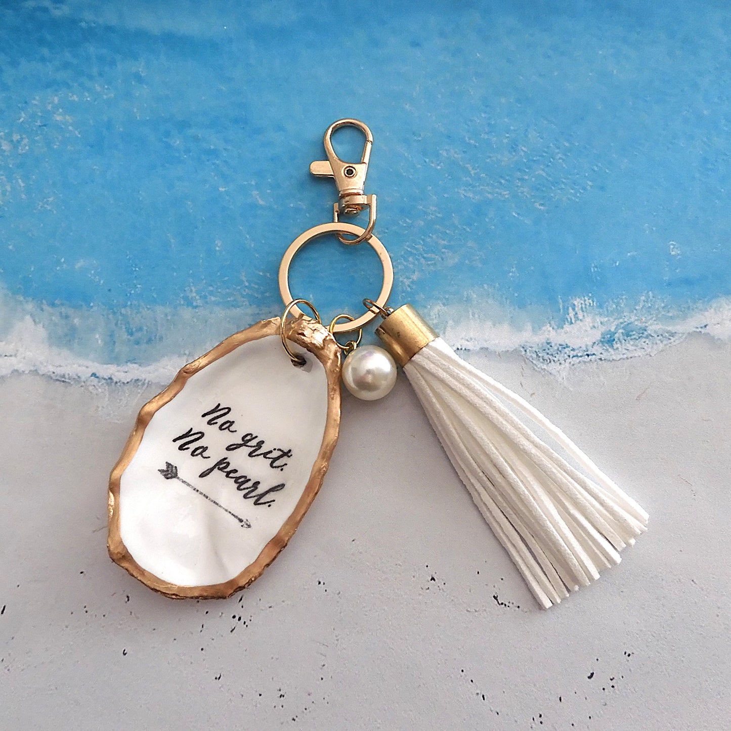 GOLD TASSEL KEYRING 'NO GRIT NO PEARL' OYSTER SHELL