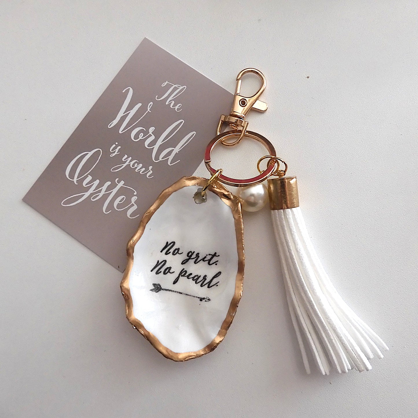 GOLD TASSEL KEYRING 'NO GRIT NO PEARL' OYSTER SHELL